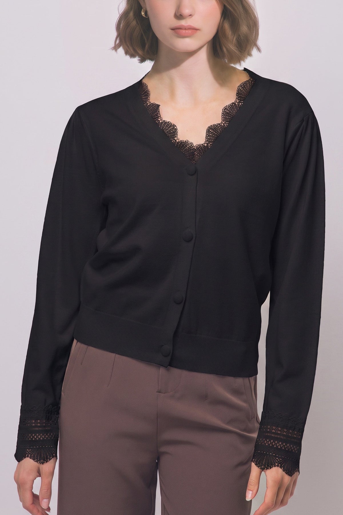 Women's lace trim knit cardigan in Black - front view on model