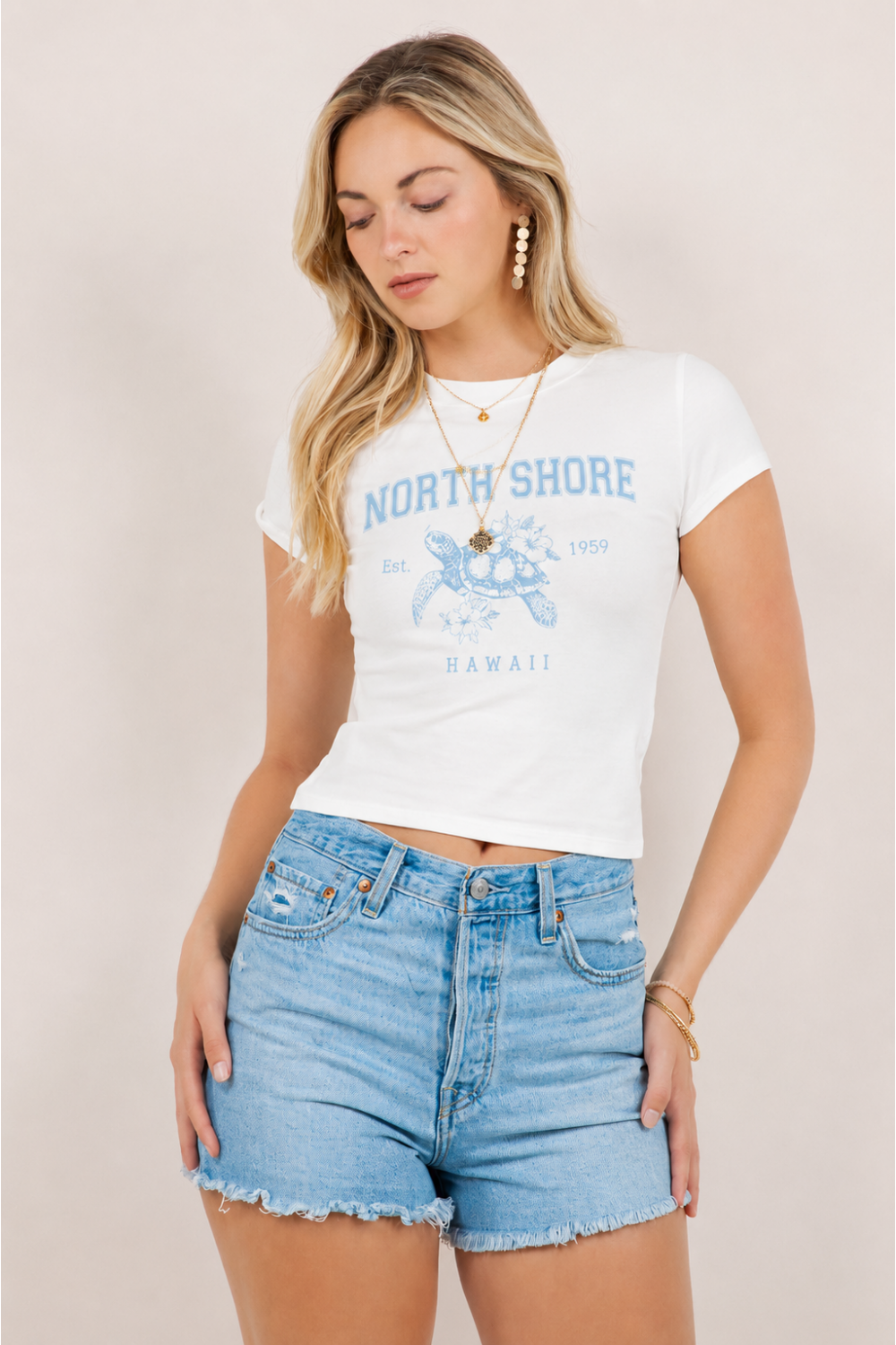 Ivory fitted baby tee with North Shore Hawaii graphic