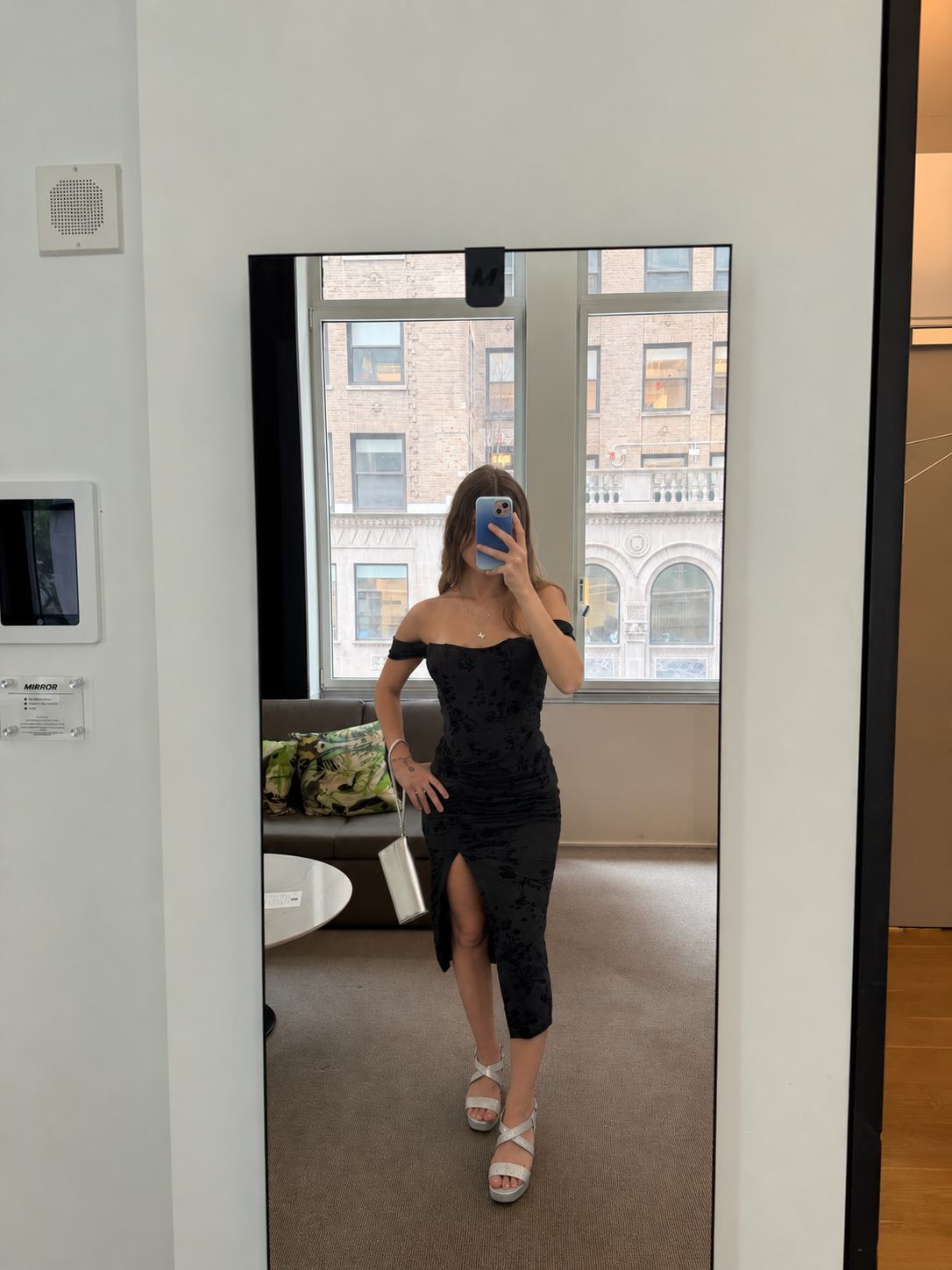 Model wearing women's black off shoulder midi dress