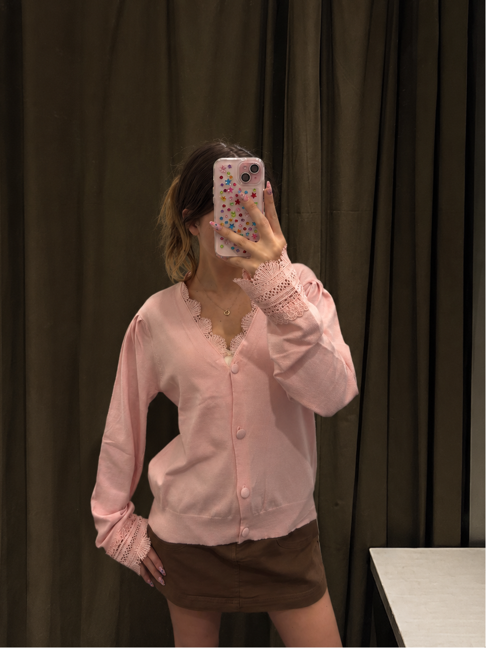 Model wearing women's lace trim knit cardigan